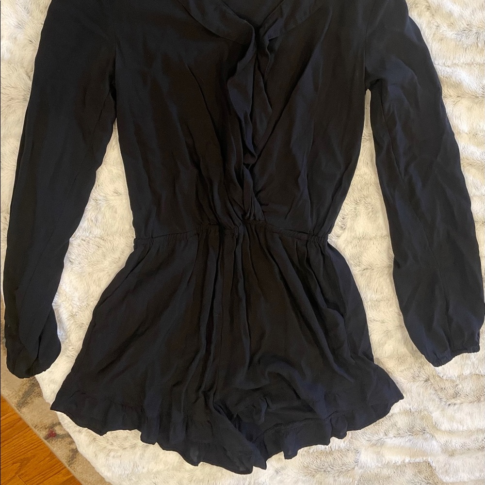 Black long-sleeve romper with pockets size S